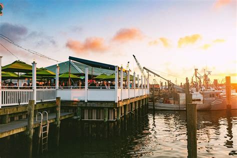 Wharfside restaurant - Photos — The Wharfside Seafood & Patio Bar. HIGH TIDE HAPPY HOUR SUN-THU ALL DAY SAT 12-5PM. Skip to Content. Menu. Story. Photos. Topside. Contact. PATIO BAR.